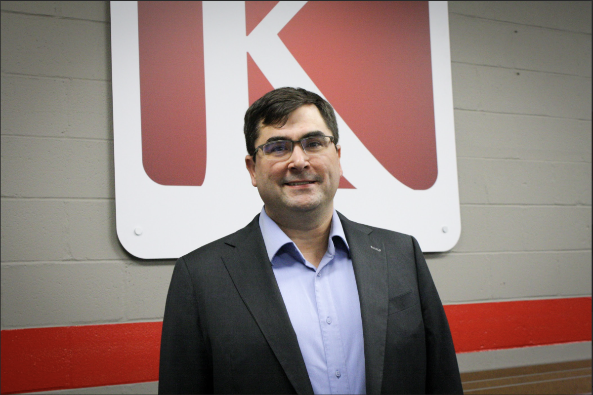 Mark Boyko standing in front of KSD sign at a board meeting.